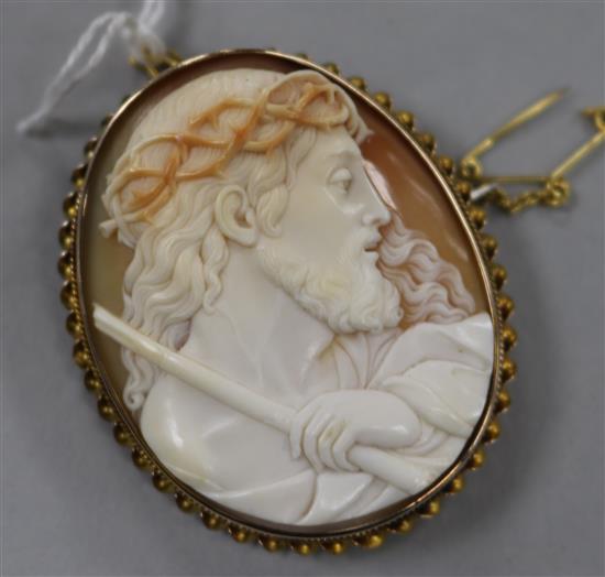 A yellow metal mounted oval cameo brooch carved with a portrait of Jesus Christ,